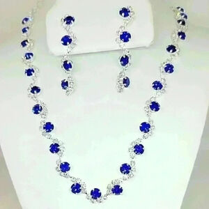 NWOT Stunning Wave Shape Blue Zircon And Crystal Necklace and Earrings S…